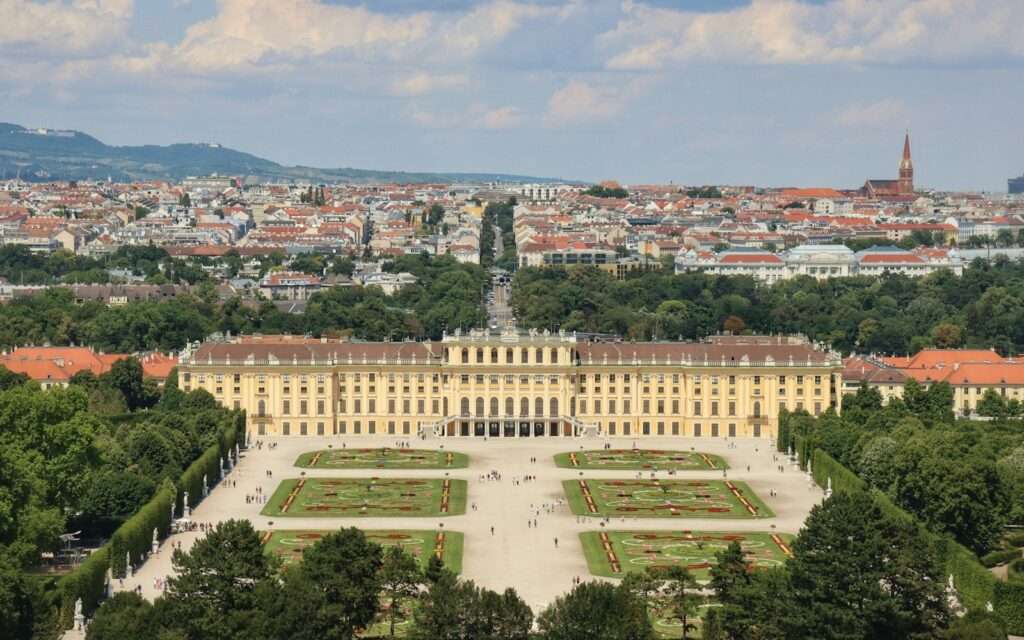 Schönbrunn Palace and its parterre gardens seen from the Gloriette with Vienna beyond