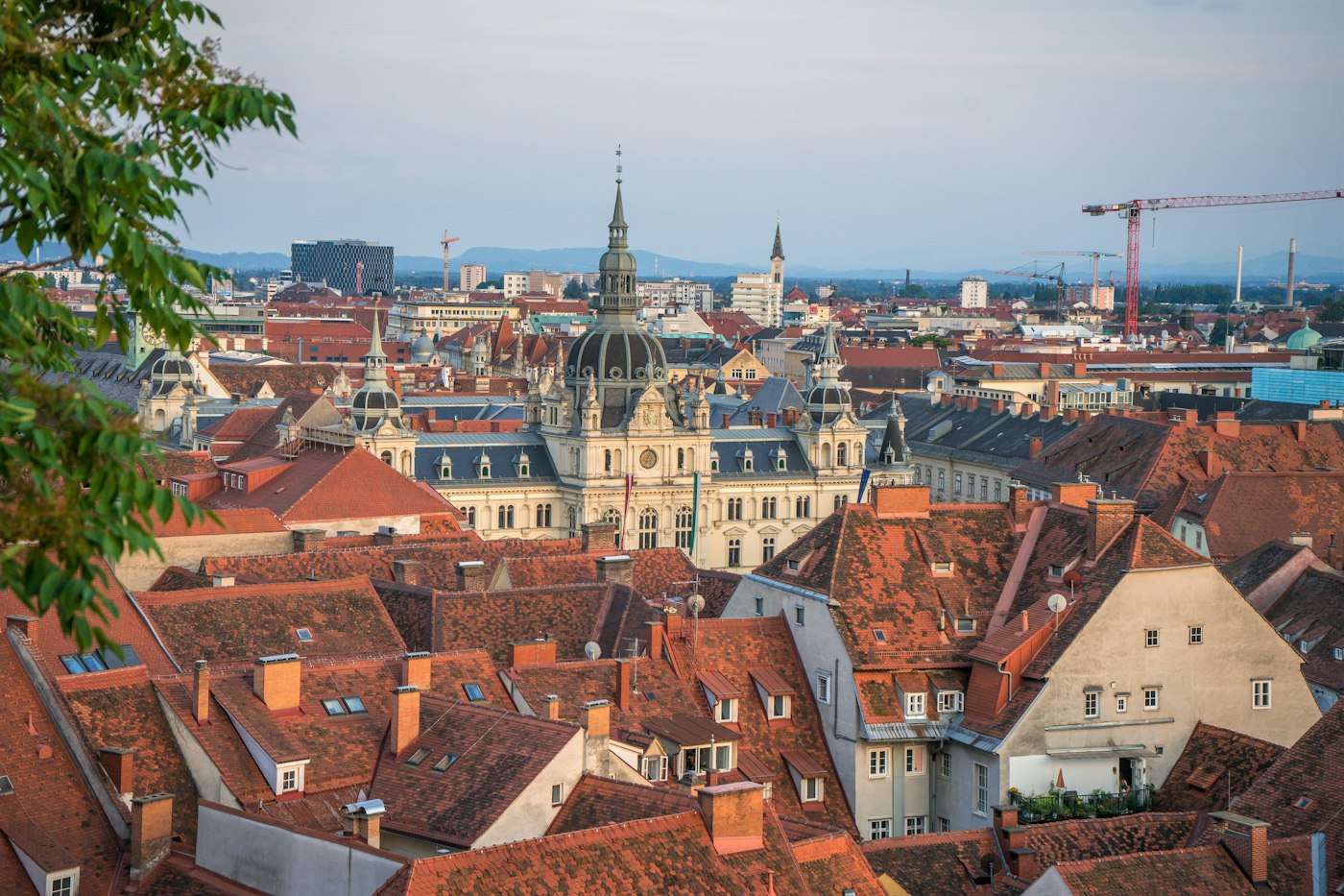 Red rooftops and the Rathaus dome of Graz seen from the Schlossberg